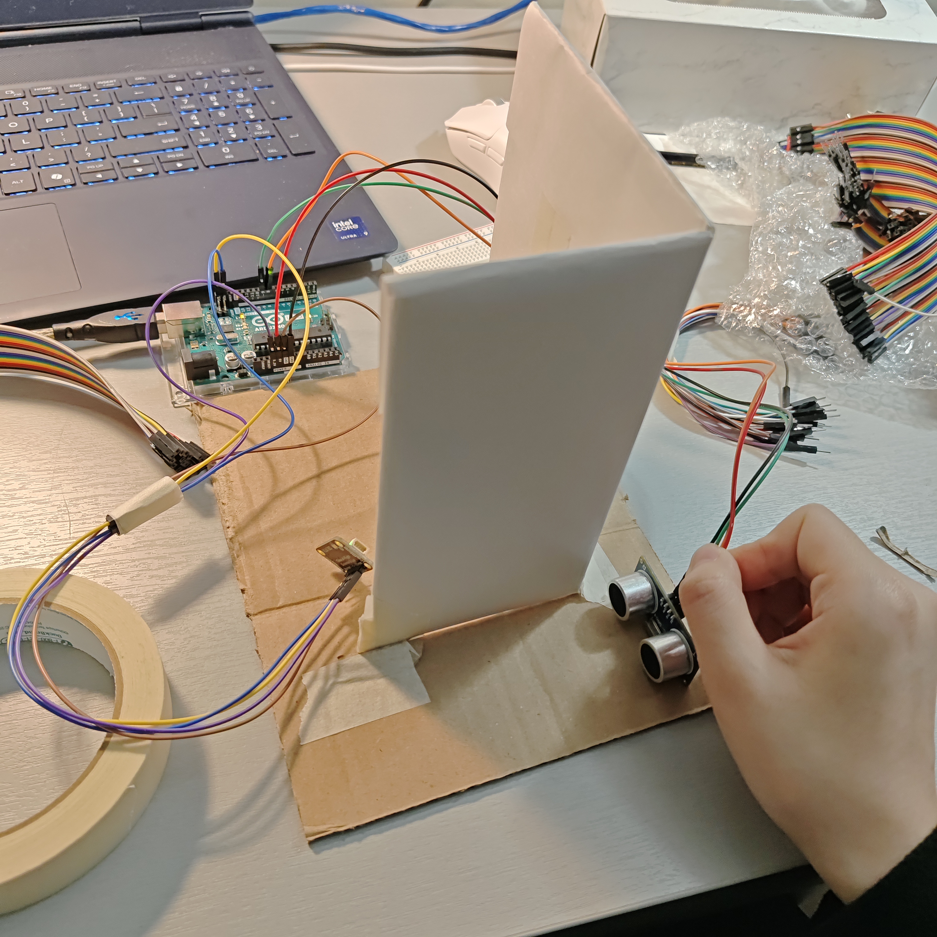 I built a simple prototype door to hold the sensors and Arduino.